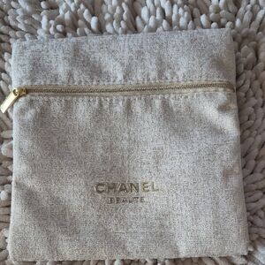 CHANEL Textured Beige Pouch with Gold Accents